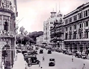 Colombo Fort | Historic black-and-white view of Colombo Fort’s York Street, colonial façades and the Cargills corner, with vintage cars and pedestrians.